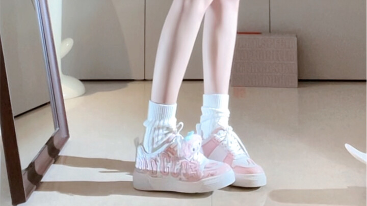 The peach-pink lettered shoes are so cute!