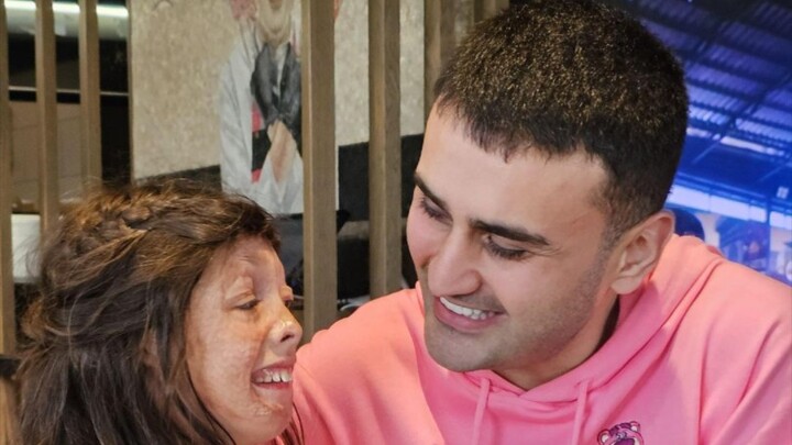 Mr. Fake Smile Cares for a Little Girl