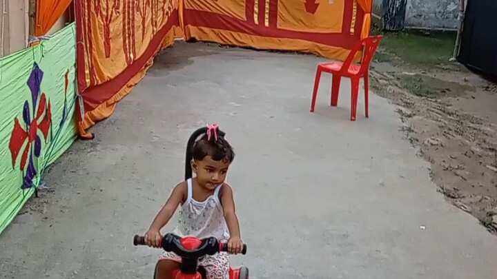 "Watch this little driver take over the world! 🚗💨"