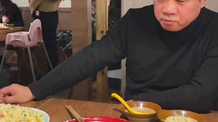 While Mom’s in the bathroom, the daughter nudges Dad: “There’s a beautiful girl behind you!” Dad is 