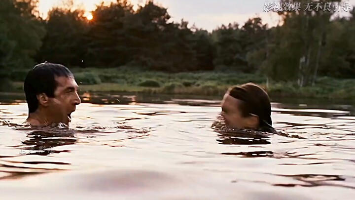 The man was just playfully splashing around in the lake with his wife, reliving their childhood joys