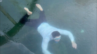 There's someone under the ice!