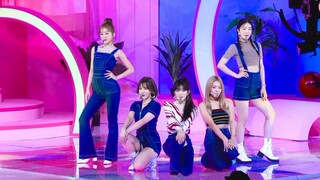 Each girl group raises their hands above their heads and starts singing