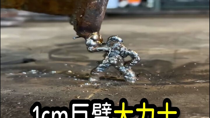 1cm giant arm, strongman, the steel magician clocking in for work