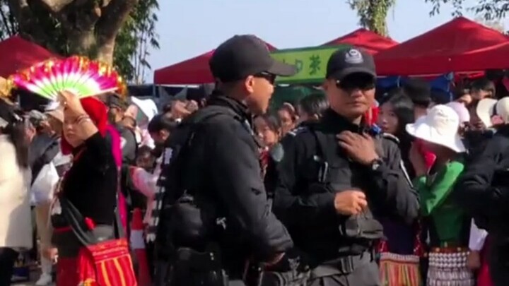 Even the special police are dancing at the Nuo Festival.
