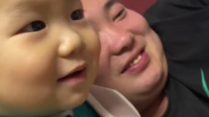 Dad and his son watch beauty short videos together, both flashing their “back-to-school” smiles righ