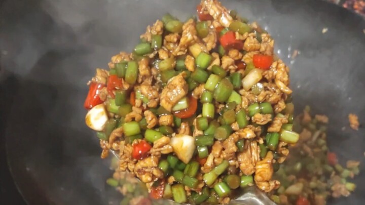 Today I made minced chicken stir-fried with garlic scapes for my mom. She said it goes perfectly wit