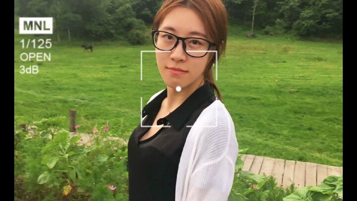 No smile in her glance, yet a hundred charms arise.