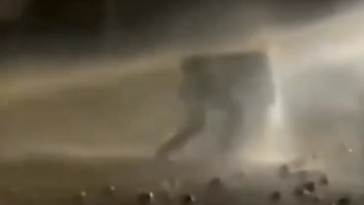 Colombian Riot: Man Shields Himself from Government Water Cannon with a Homemade Shield!