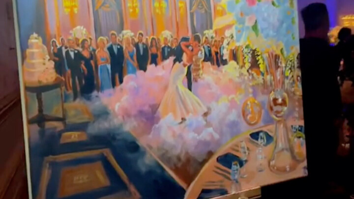 An artist painting live at a wedding, capturing the most beautiful moment.