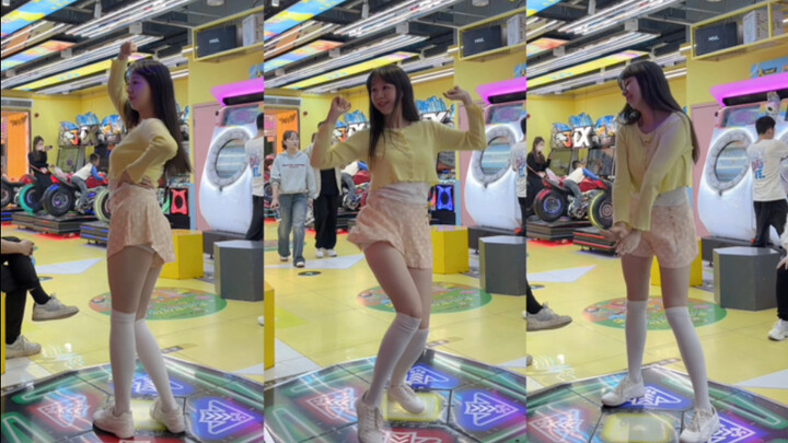 Flesh-pink shorts with white socks—this confident girl is rocking the dance machine, shaking it!