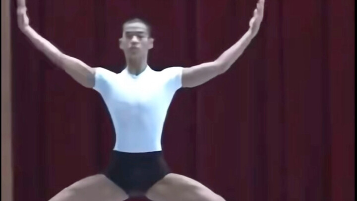 TARZZAN dances modern dance—such a contrast! Such a scary-looking dark face.