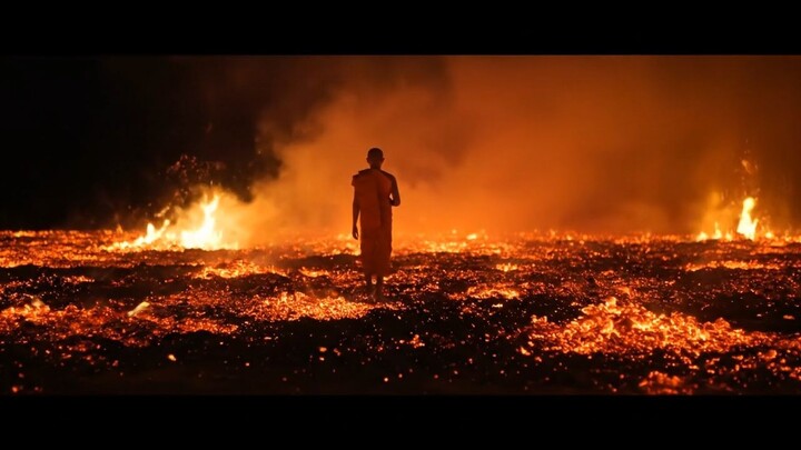 A monk feet walking on a surreal realistic ground made of embers smoky.
