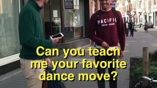 Inviting passersby to teach a dance move they love most: