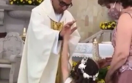 A little girl who didn't know the baptism ceremony yet