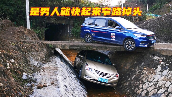 What a pro—making a U-turn on this narrow road!