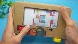 Buatan tangan DIY "Mesin Game Manusia Serigala Luar Angkasa" dalam kotak kertas bekas untuk anak-ana
