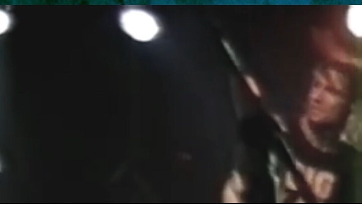 A Guy Sticks His Tongue Out at Krist Novoselic on stage