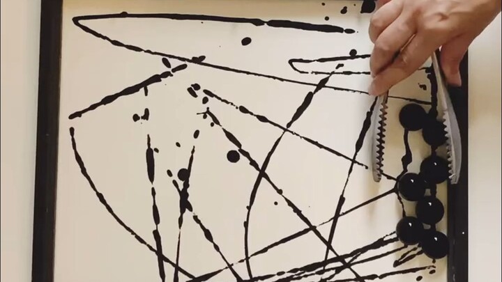 Can you believe an artist who paints with glass marbles?