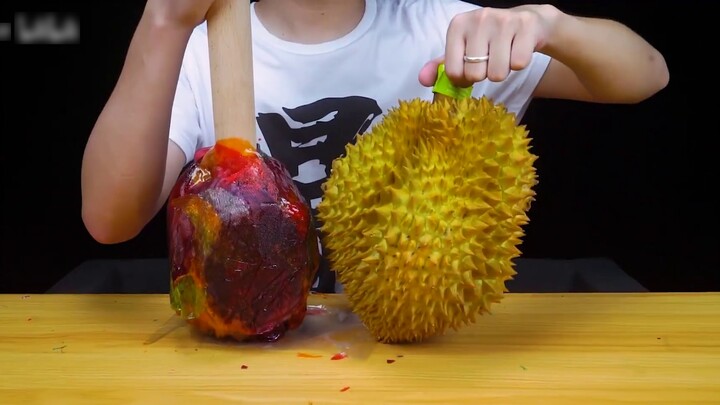 The guy challenged himself to throw 1,000 malt candies at a durian. The moment he swung it down, it 