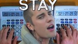 Memainkan The Kid LAROI - Stay with.Justin Bieber dengan 3 kalkulator.