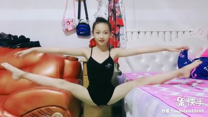 Young dance student does a suspended negative-angle straddle…