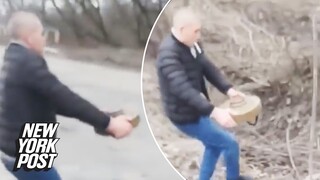 Ukrainian man removes mine from roadway while smoking cigarette | New York Post