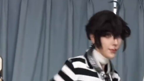 Luca's serious look with a slicked-back hairstyle