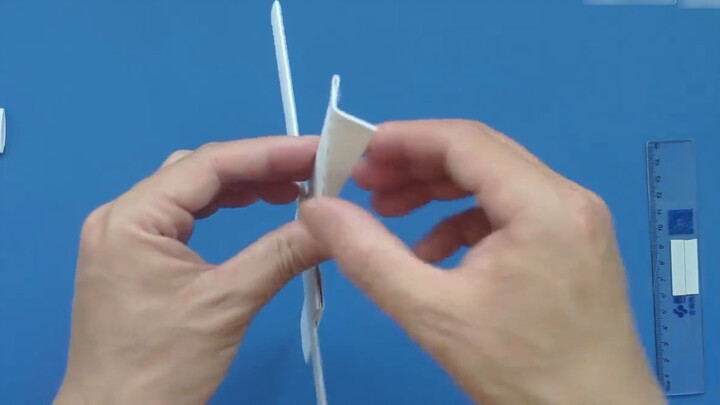 Tutorial on how to fold a boomerang, a dart that can be turned back by adjusting the angle