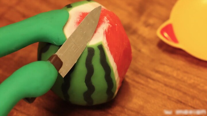 Plasticine stop motion animation: Cutting a frozen watermelon again in late summer