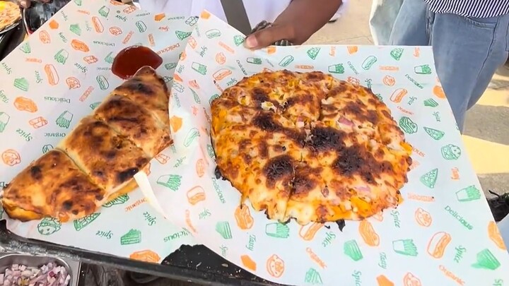 98 rupees for an all-you-can-eat cheese pizza—there’s no way I can finish it.
