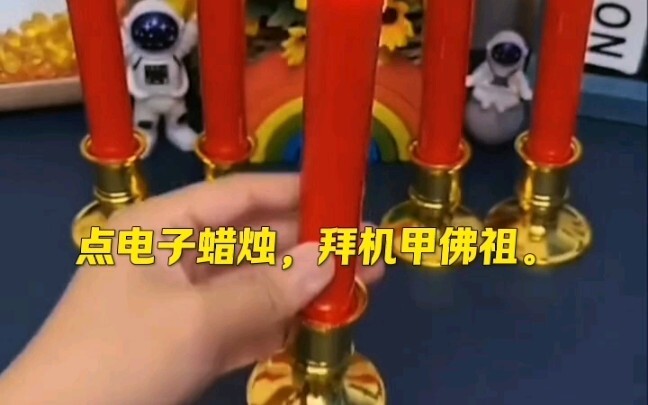 จุดเทียนไฟฟ้า ไหว้พระพุทธเจ้าหุ่นยนต์