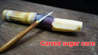 Carving in a piece of cane