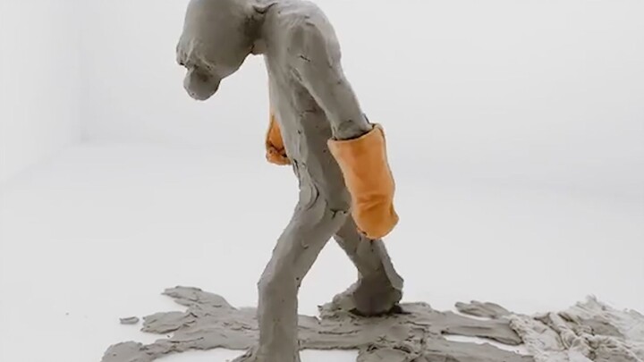 A mud man is locked in a white room; the more he cleans, the dirtier it gets, and he dies of exhaust