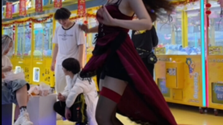 Black silk high heels with a sophisticated, commanding vibe—paired with a mesmerizing red dress, giv