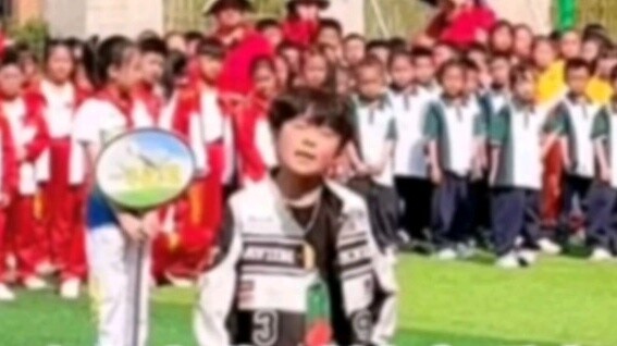 At the opening ceremony of the sports meet, the music teacher pulled the kids out to perform a piece