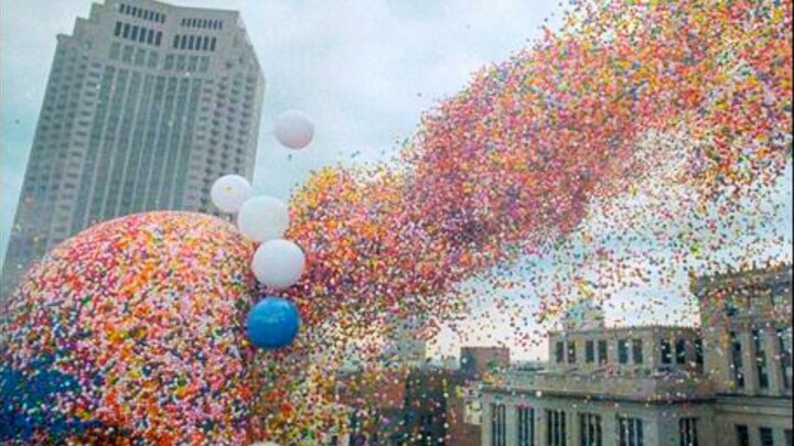What happens to a city in one day if 1.5 million balloons are released simultaneously?