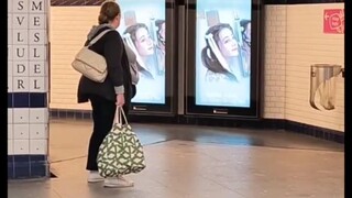 Passers-by on the streets of Paris, attracted by the goddess of beauty