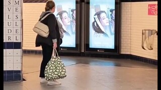 Passers-by on the streets of Paris, attracted by the goddess of beauty