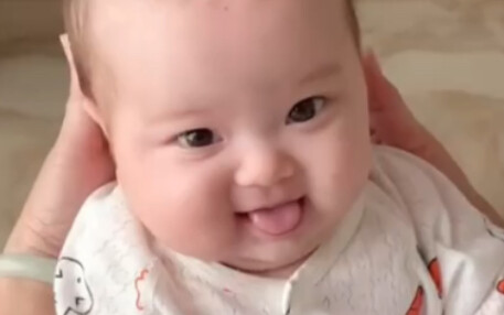 At 3 months old, he already loved sticking his tongue out.
