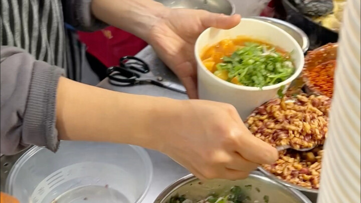 Will you try this street-style stinky tofu loaded with toppings and smelling delicious?
