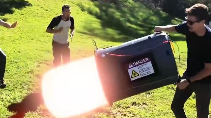 A man actually invented a laser cannon—just look, with one powerful flick, he fires out a beam of la