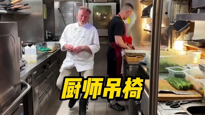 An Austrian chef works while seated in a hanging chair, simply because foot injuries make it hard to