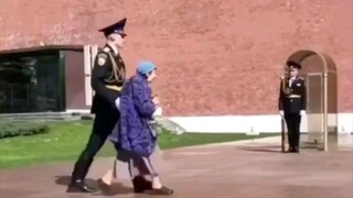 An exception was made to allow the elderly lady to step forward and lay flowers.