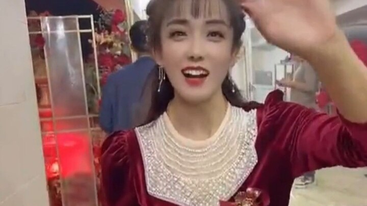 At the wedding, the mother-in-law was mistaken for the bride by the guests; dressed in a festive red