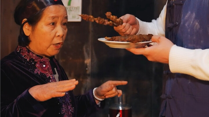 At midnight, the boss lady brings over lamb skewers!