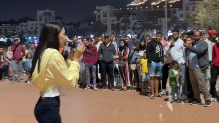 On the quiet seaside streets of Agadir, Morocco, my Chinese singing instantly drew a crowd, turning 