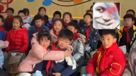 A cute little girl gets scared while watching a cartoon and instinctively hugs the boy sitting next 