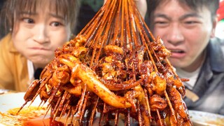Challenge the spiciest Sichuan street food! A handful of tripe soaked in chili peppers. Locals warn: