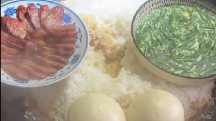 We’re at my aunt’s place enjoying a wood-fired meal—steamed eggs and Chinese sausage; it smells so g